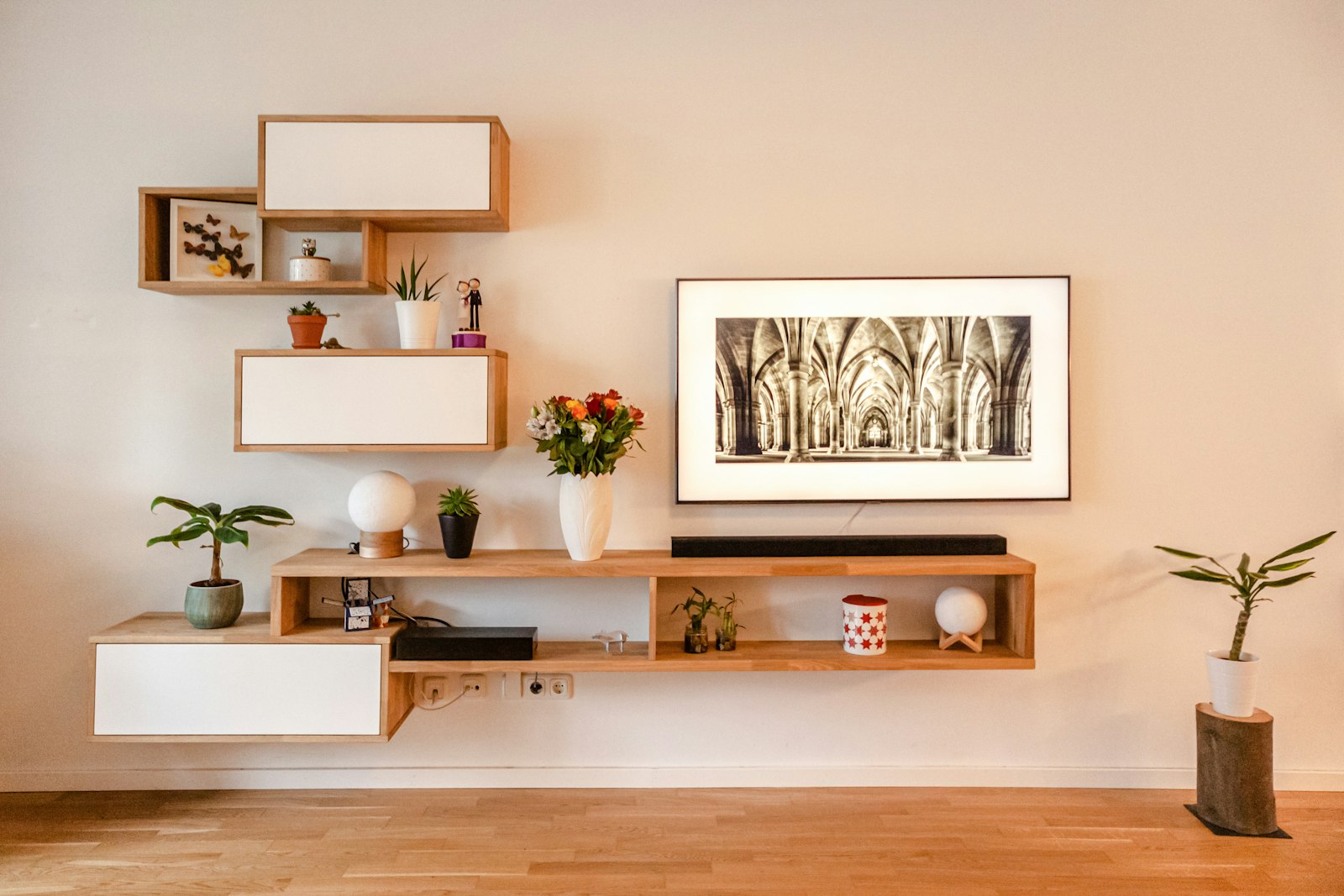 Wall-mounted walnut media console with open shelving