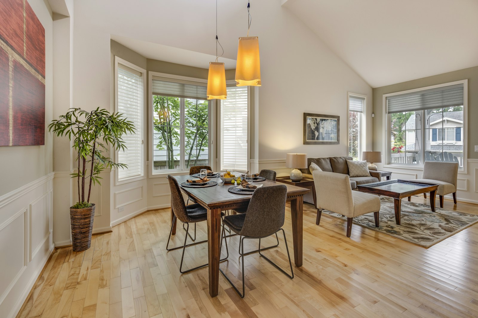Dining room with a wooden table and warm pendant lighting