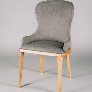 Dove grey upholstered dining chair on a white background