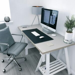 White oak height-adjustable desk in a bright home office