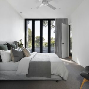 Serene bedroom with an upholstered platform bed and soft grey bedding