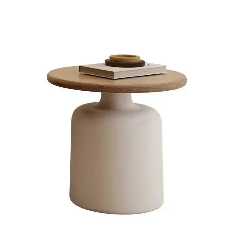 Close view of the wood panel top and painted white pedestal base
