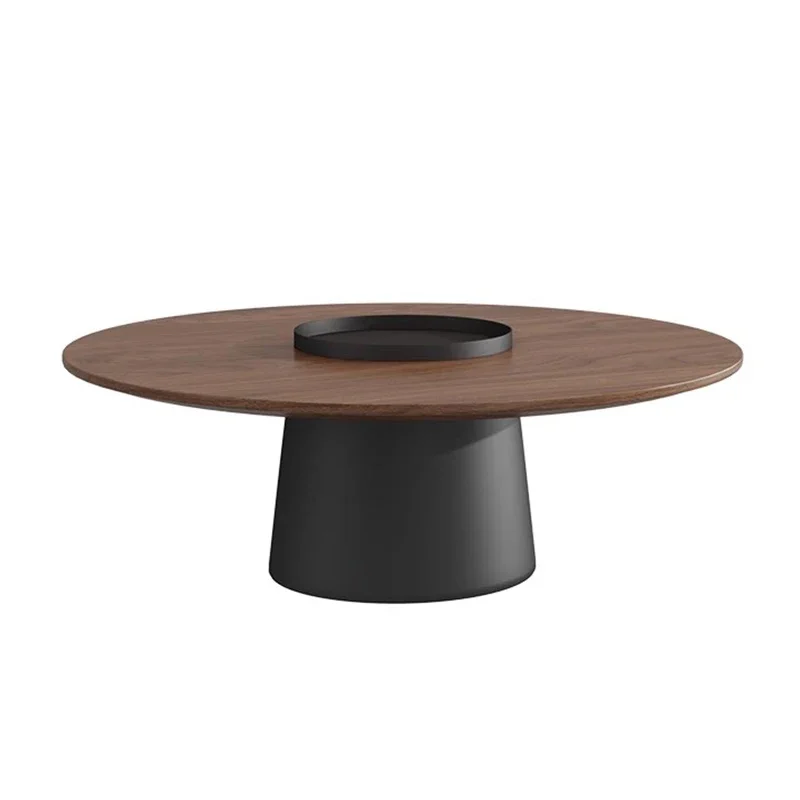 Round walnut-tone coffee table shown from the side, matte black tapered pedestal base